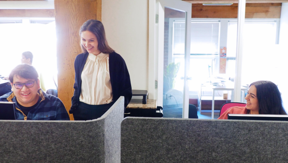 Chloe_Brand QA Blog_team at their desks working together